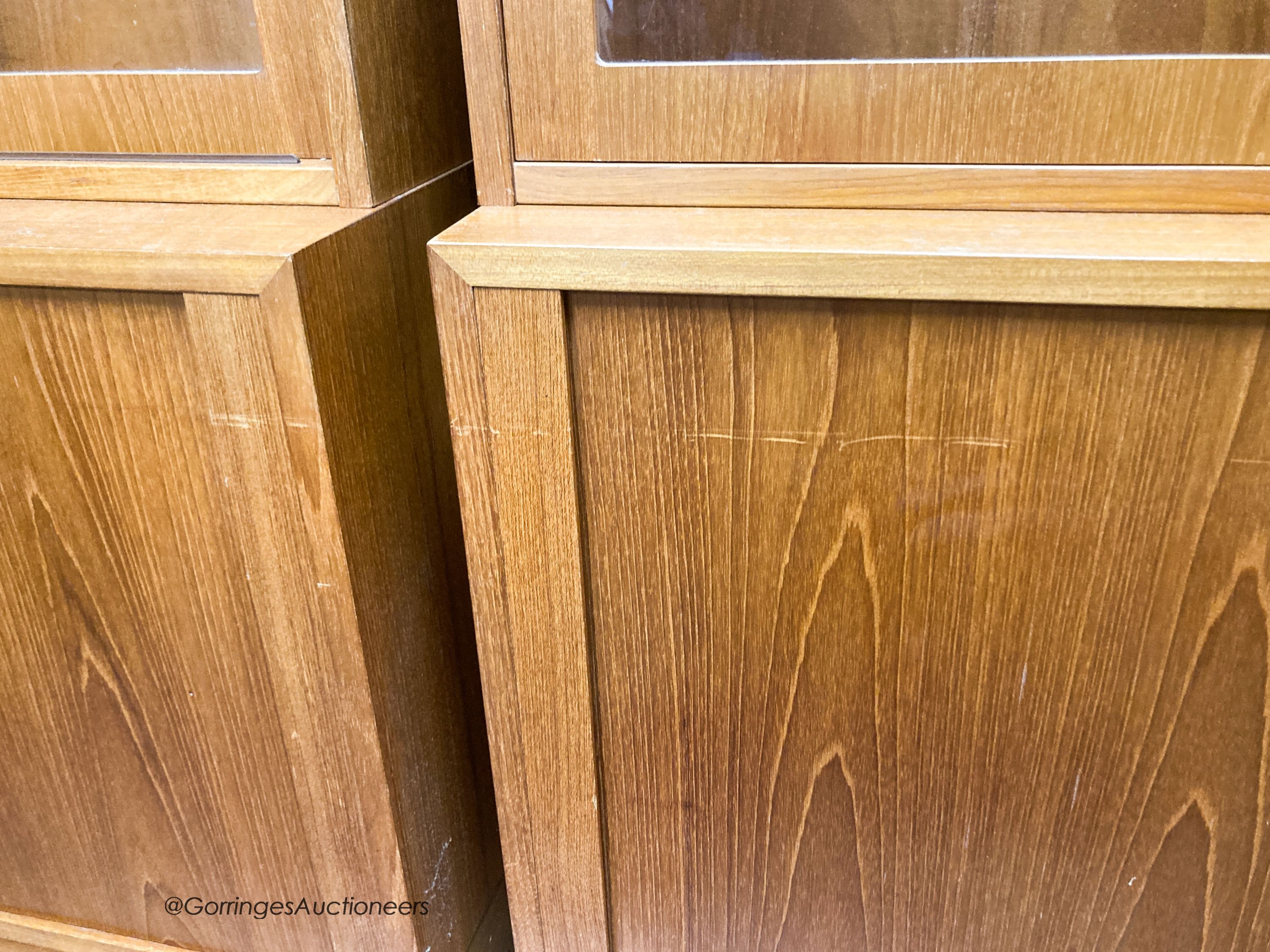 A pair of Harrods teak display cabinets, width 108cm, depth 43cm, height 196cm
